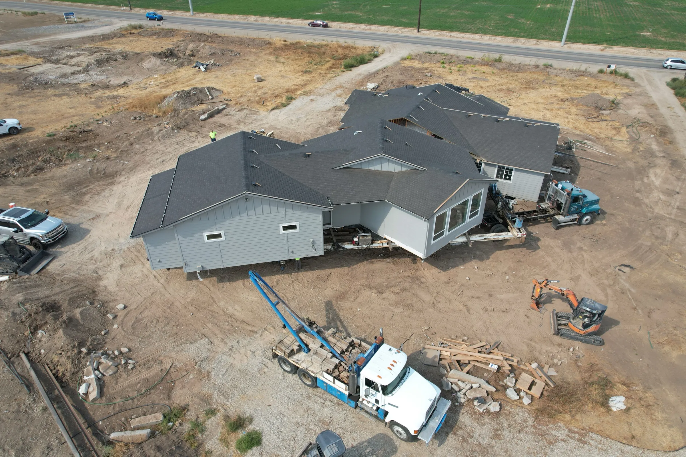 Aerial view of the two house halves being reassembled on the new lot