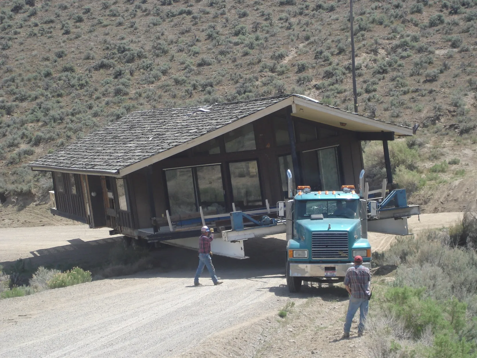 Crew and truck with the house loaded