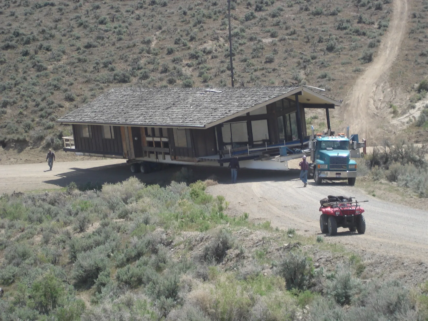 House descending a desert grade