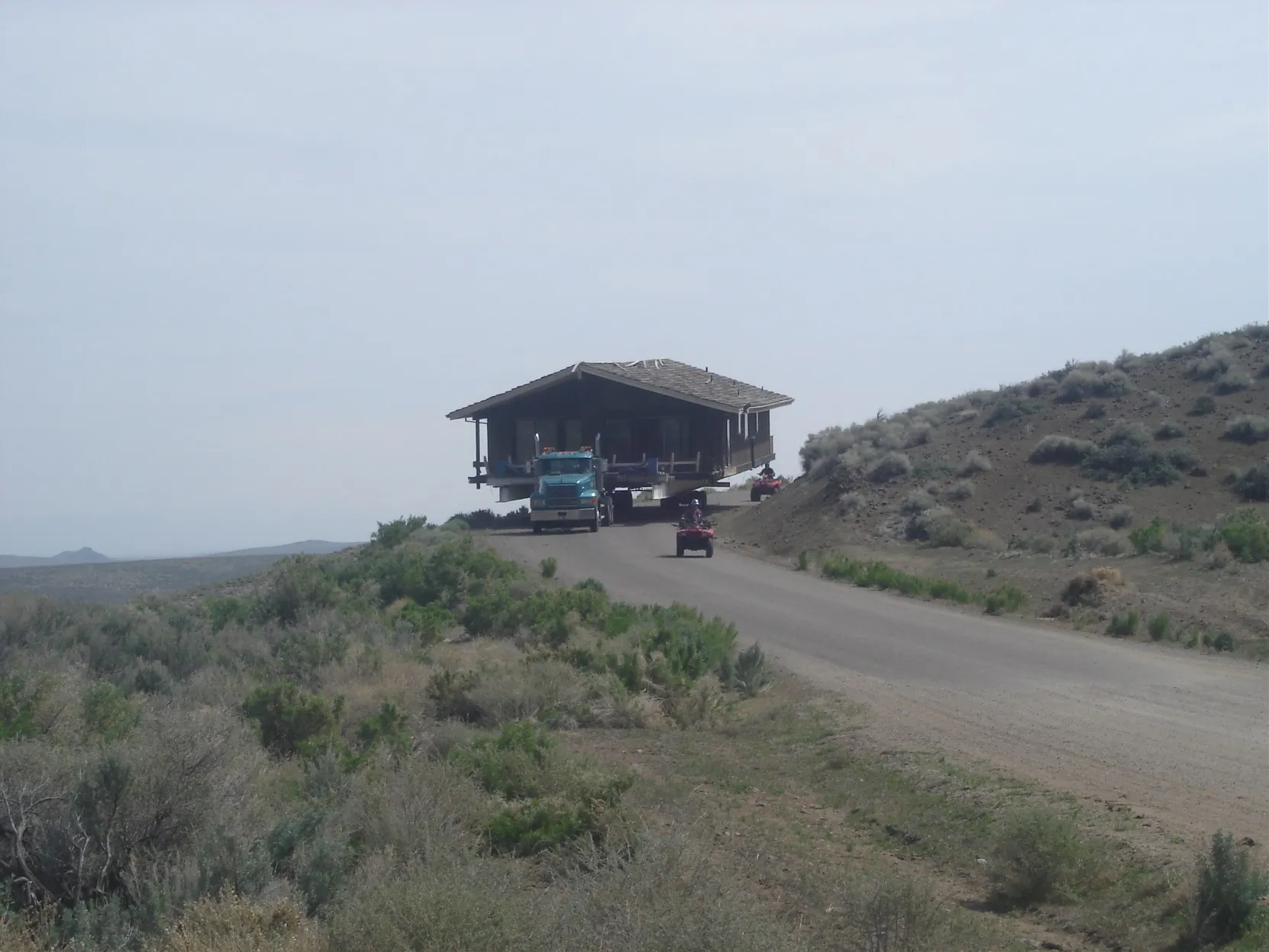 House on a trailer on a distant desert hilltop