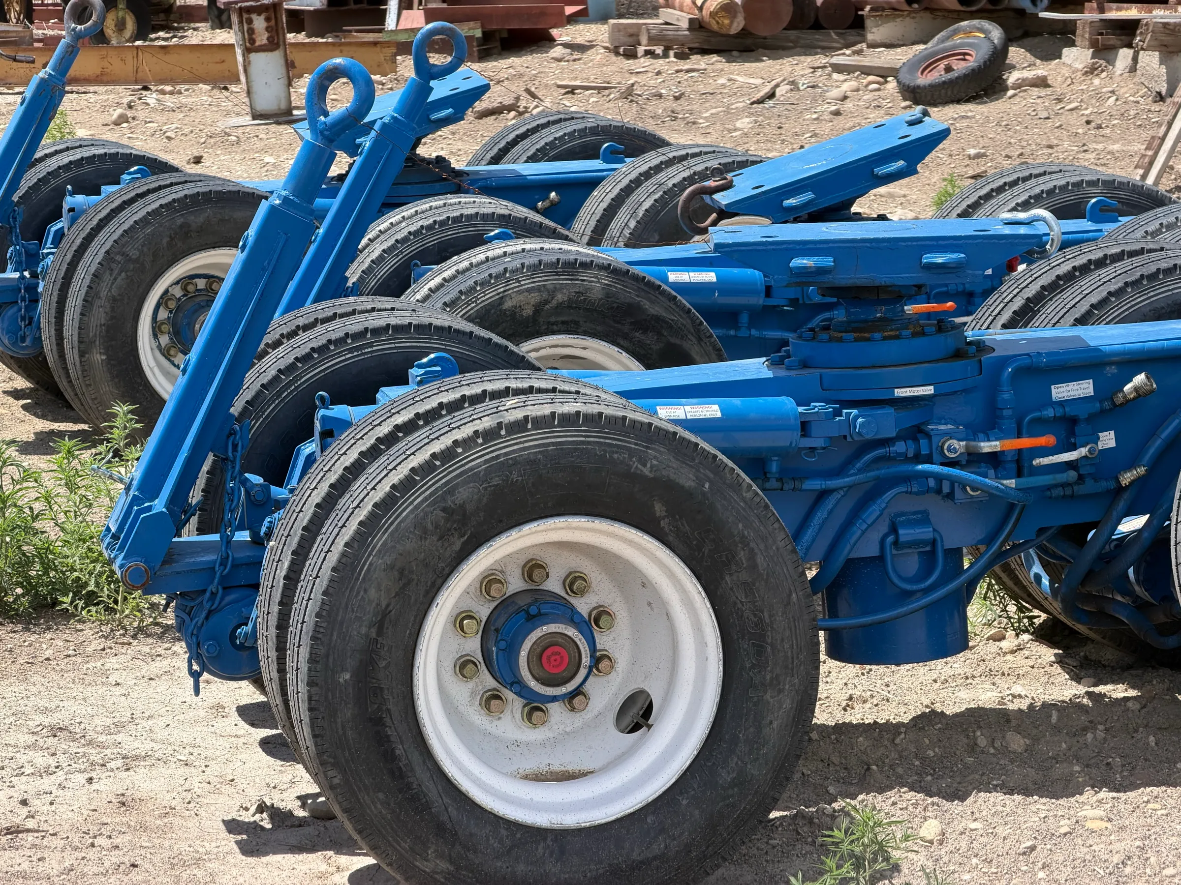 Row of hydraulic moving dollies in the Western States Movers yard