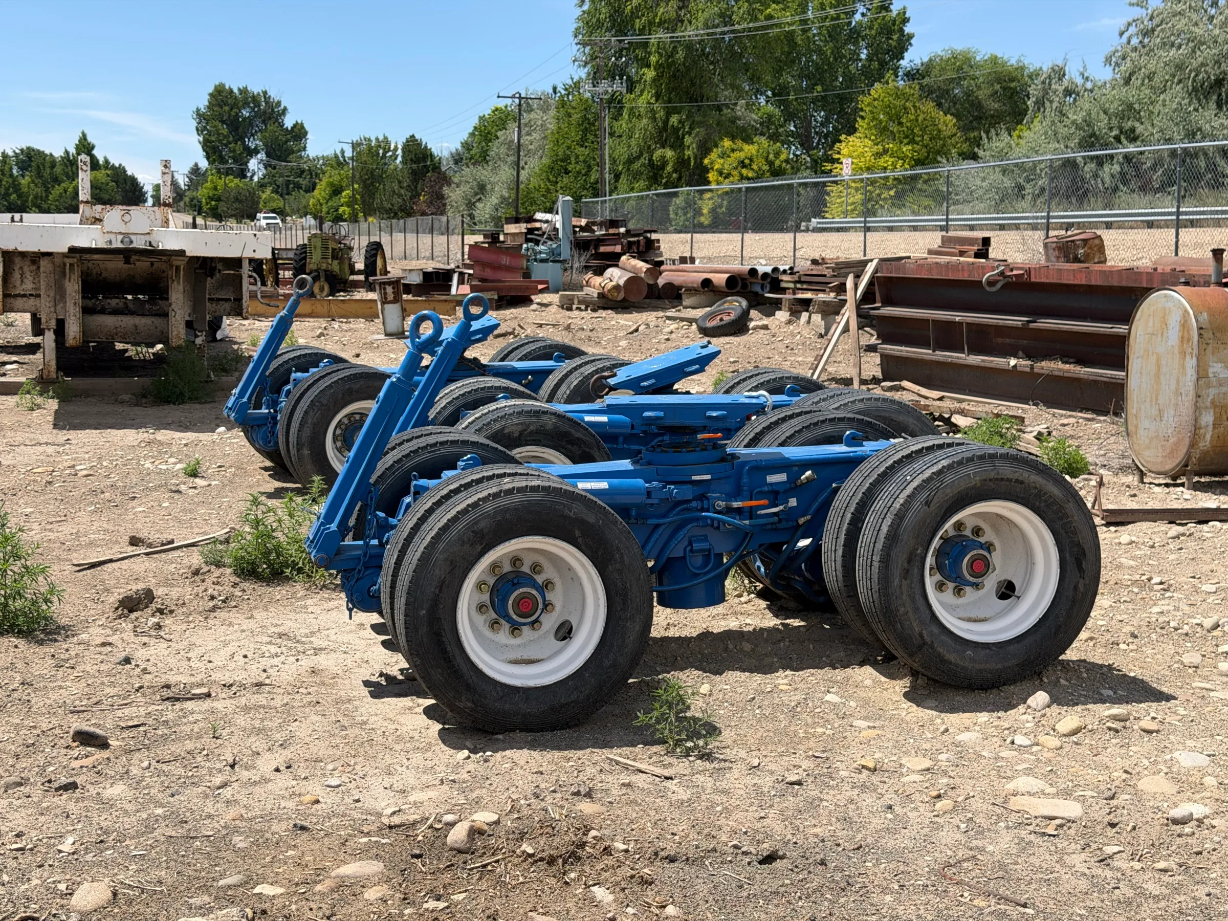 Lineup of hydraulic moving dollies in the yard
