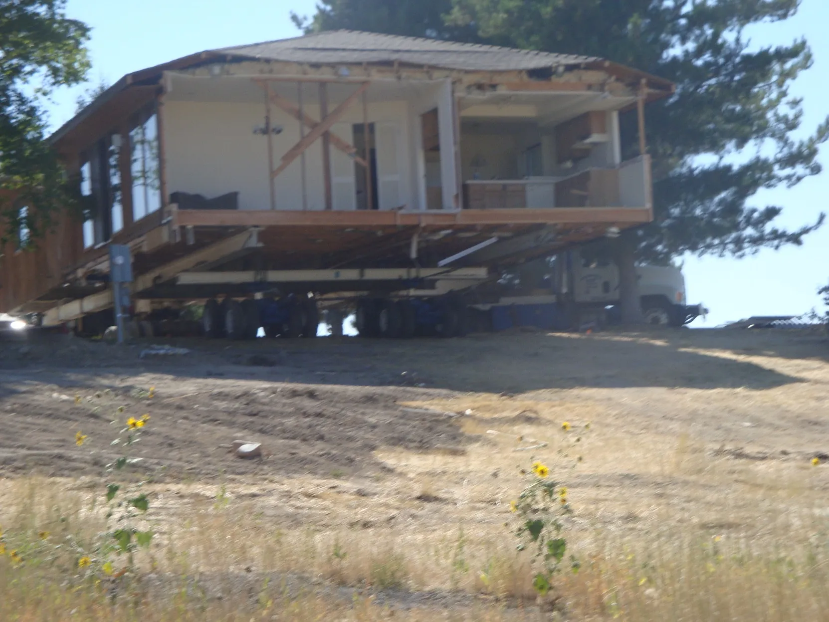 House raised on cribbing for foundation work