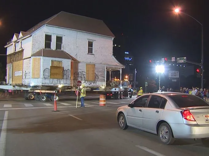 The Basque house moving at night with onlookers