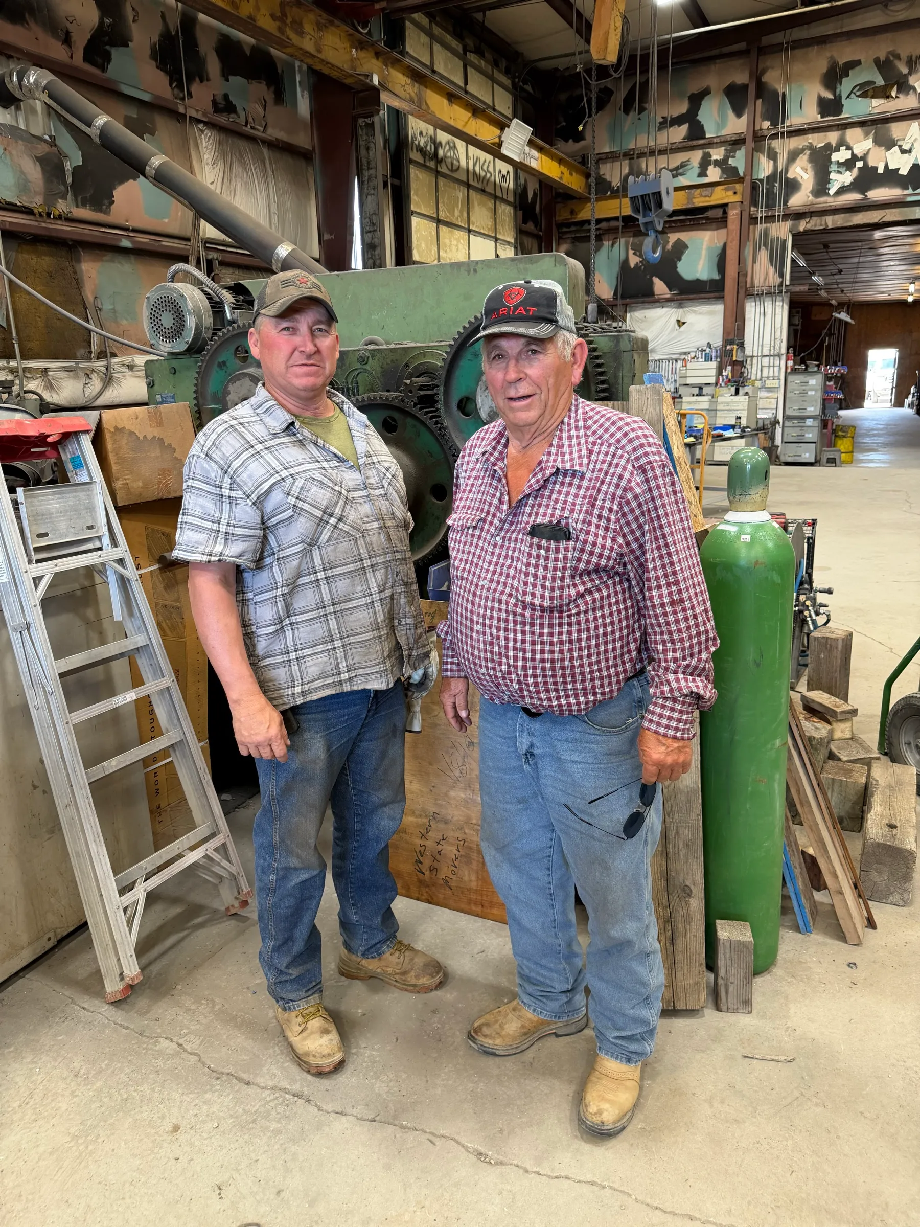 Shawn and Kenny Pfeifer standing together in the Western States shop