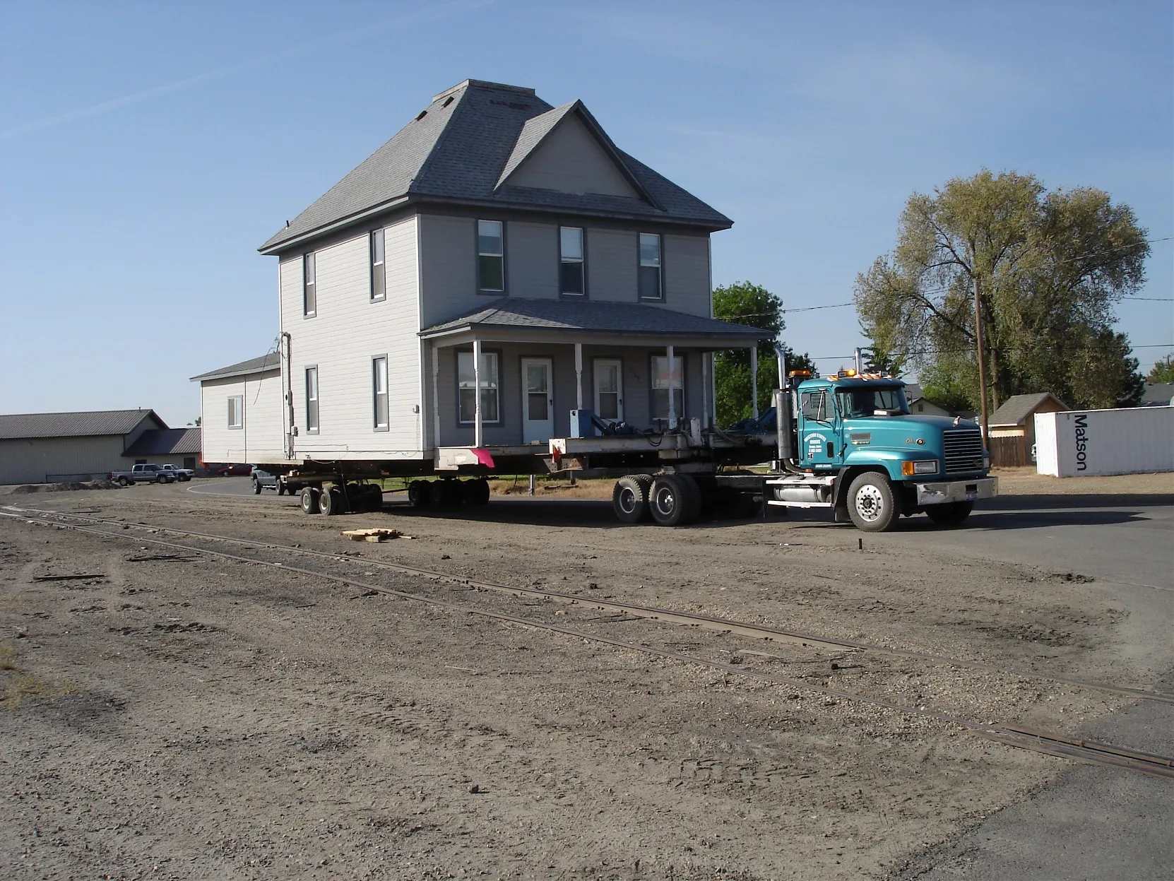The two-story house on the lot, wide view
